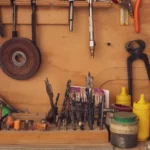 A variety of carpentry tools and equipment neatly arranged in a traditional Mexican workshop.
