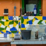 Vibrant outdoor setup features mosaic tiles and eclectic decorations in Las Palmas.